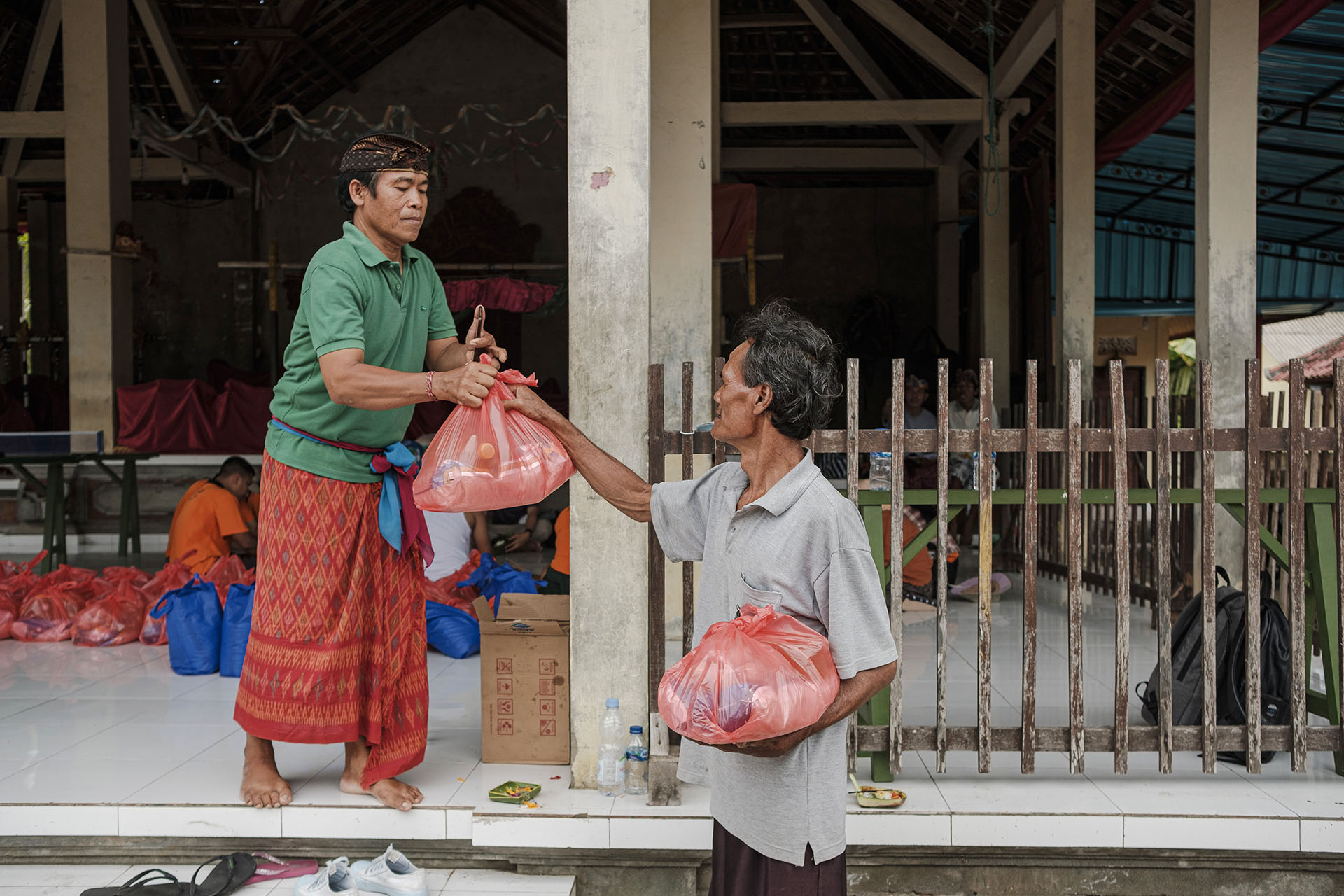 Food supplies being distributed by the Head of the village