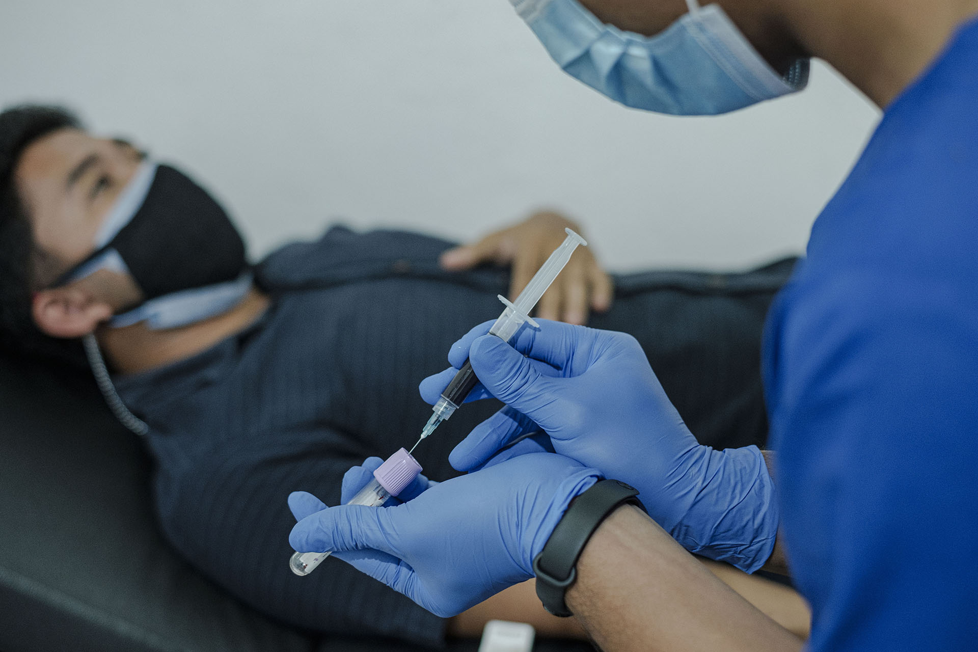 Taking a blood sample from a simulated patient